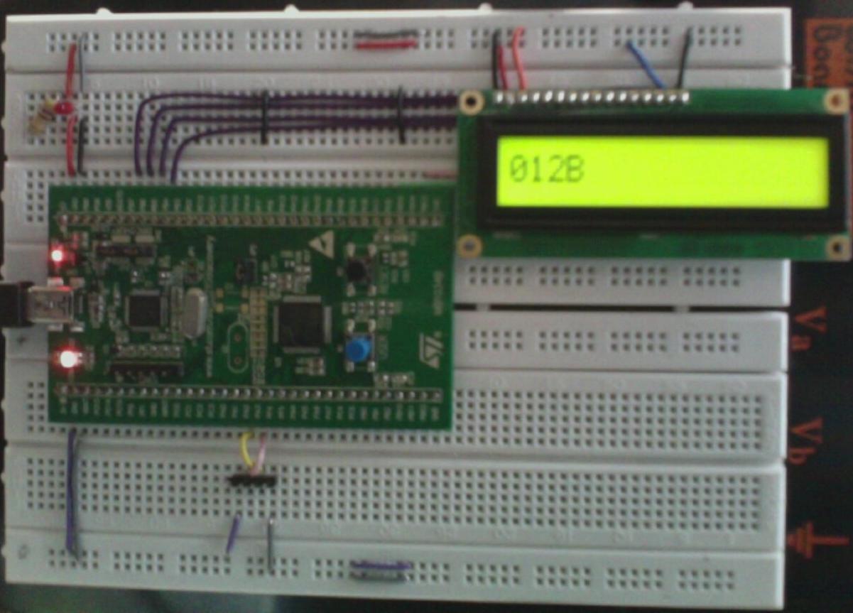 Picture showing breadboard with stm32f0discovery and lcd dislay attached